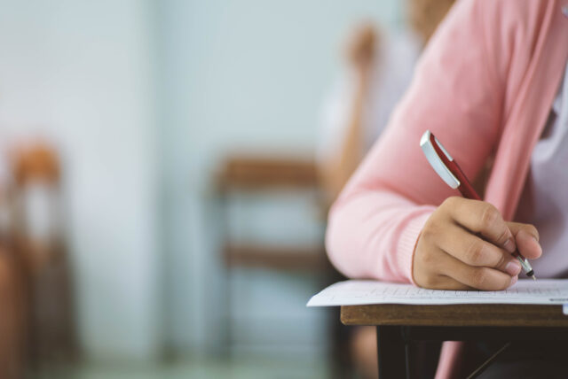 a photo of a woman taking a test